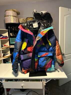 Sacai x KAWS Print Puffer Parka Jacket Multi Color